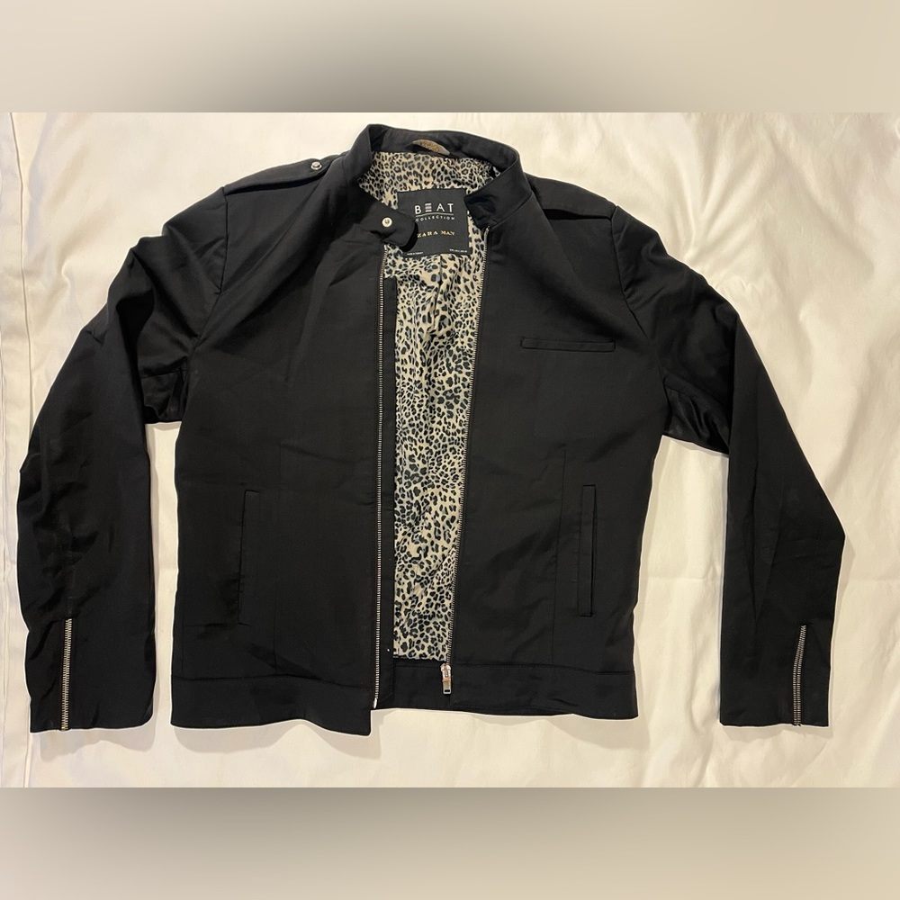 Zara men’s light jacket, black with animal print lining.